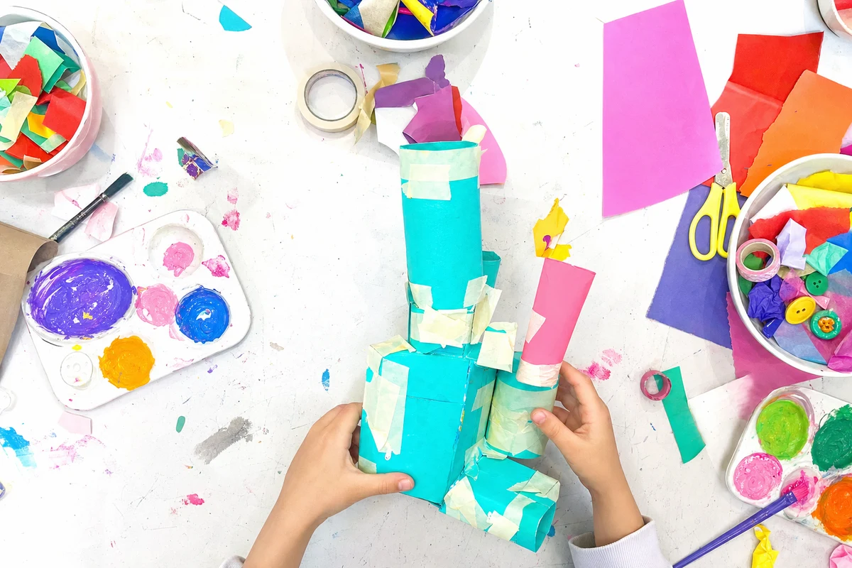 A lopsided build of boxes and tubes held together with masking tape